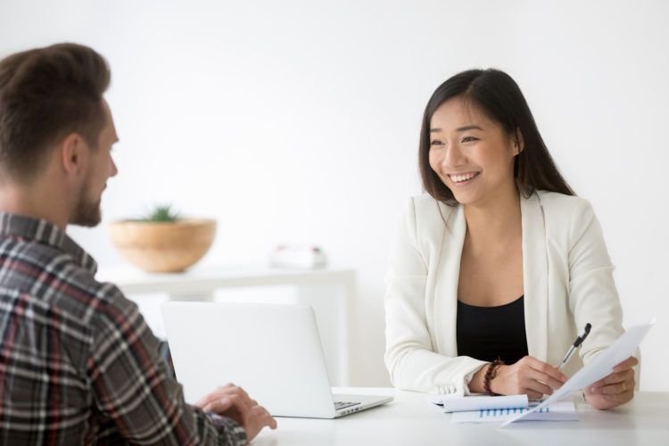 Friendly,Asian,Hr,Smiling,Laughing,Talking,To,Candidate,At,Job